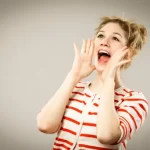 Woman shouting, a metaphor for traditional marketing channels